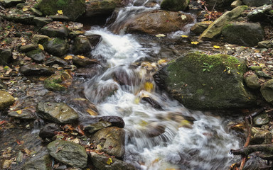 River water with rocks and waterfalls