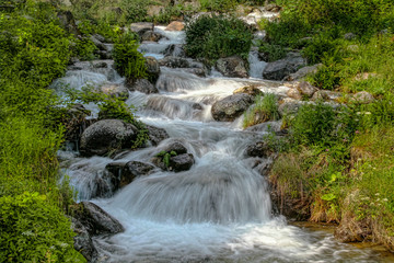 River water with rocks and waterfalls