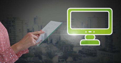 Hand holding tablet with computer icon