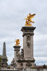 Fototapeta na wymiar The Pont Alexandre III is a deck arch bridge that spans the Seine in Paris.