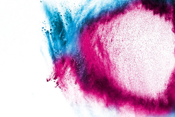 Abstract multicolored dust explosion on white background. Abstract color powder splattered  on...