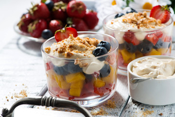 fresh fruit dessert with custard in glasses