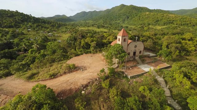 Church on a hill in Malbato village. Philippines. Coron. Palawan. Aerial view.