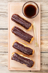 Traditional french eclairs with chocolate.