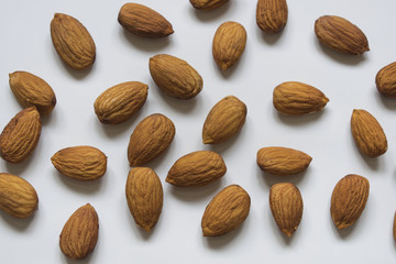 Almond seed on white paper