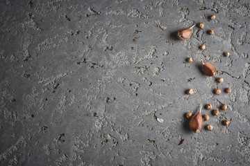 chickpea and garlic on the grey concrete backdrop