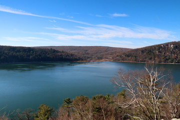Beautiful autumn landscape with lake. Scenic fall view from rocky south shore Ice age hiking trail at Devils Lake State Park, Baraboo area, Wisconsin, Midwest USA.