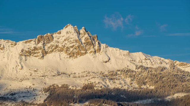 Chabrieres Needles (Aiguilles de Chabrieres) in Winter between sunset and twilight (timelapse). Ecrins National Park, Hautes-Alpes, French Alps, France