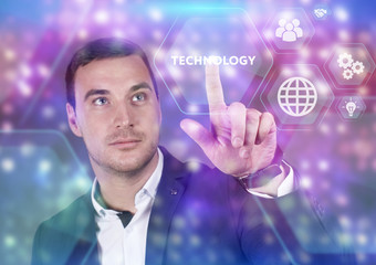 Business, Technology, Internet and network concept. Young businessman working on a virtual screen of the future and sees the inscription: Technology