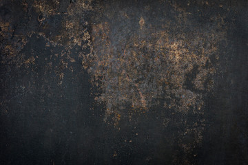 Black grunge cement wall for use as a background