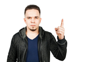Portrait of a dissatisfied guy lifting his index finger up. isolated on white.
