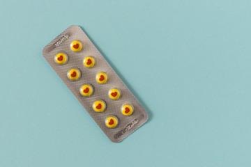 Symbol of heart on pills, as an example of internet addiction.