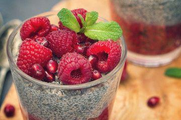 Chia seed pudding with fresh raspberries and pomegranates