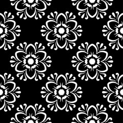 White floral design on black background. Seamless pattern
