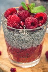 Chia seed pudding with fresh raspberries and pomegranates