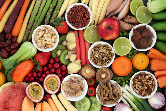 Super food for good health concept with fresh fruit and vegetables and chinese herbal medicine selection with foods high in anthocyanins, antioxidants, vitamins, minerals and dietary fibre. Top view.