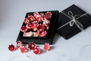 meringue pink with red flowers in black box