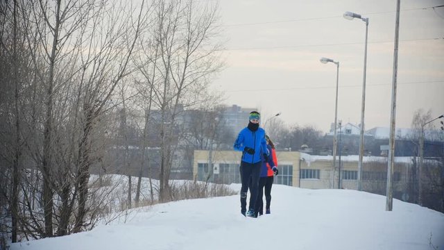 Three young athletes running in winter outdoor