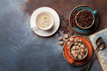 Obraz na płótnie Canvas Coffee cups, beans and sugar