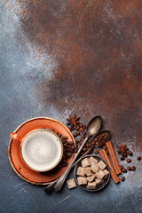 Coffee cup, beans, sugar and spices