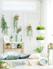 Room with a bed and a large window. Concept interior, decoration, comfort in the house.