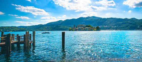 Orta Lake landscape. San Giulio island Isola view from the dock, Italy.