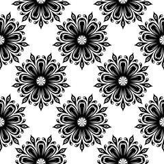 Black flowers on white background. Ornamental seamless pattern
