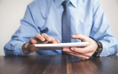 Businessman using digital tablet.