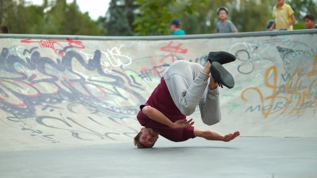 Man breakdancing on back, slow motion