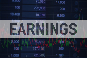 Background of numbers and trading charts with the word Earnings written above. Economy.