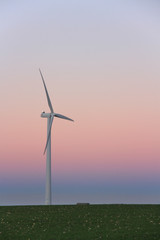 Obraz premium Wind turbine at sunset, France