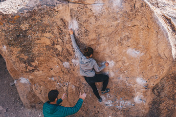 Strong Woman Bouldering Outside in Bishop