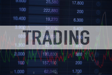 Background of numbers and trading charts with the word Trading written above. Economy.