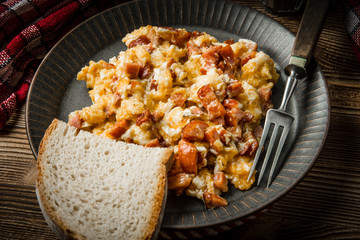 Scrambled eggs with sausage.