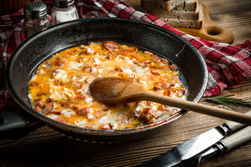 Scrambled eggs with sausage.