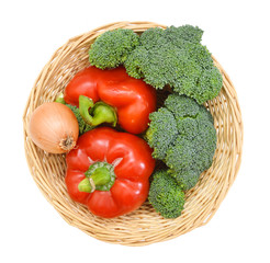 Broccoli , onion and red peppers in basket on white