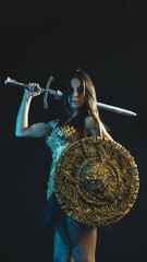 valkyrie warrior, woman with golden armor iron coat and big warrior sword