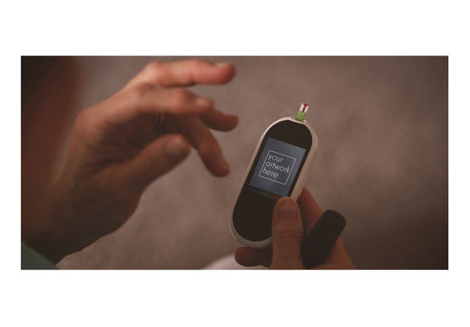 User with a Glucose Testing Device Mockup 1