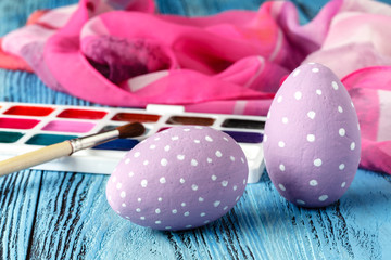 colorful easter eggs painted on wooden table
