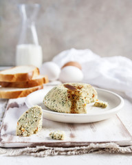 A homemade Breakfast with toast, eggs and cheese. In a rustic style. Light background. Vertical.