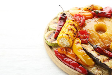 Grilled vegetable on brown cutting board