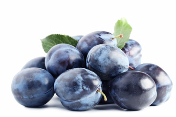 Ripe plums isolated on white background