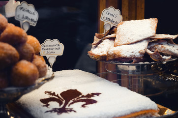 the schiacciata fiorentina, a traditional italian cake from the city of Florence (Tuscany) usually made for carnival holidays with cenci, italian angel wings sweet crisps