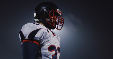 portrait of young confident American football player