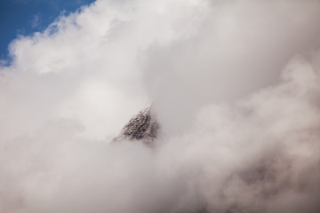 Himalaya cliff peal in fog. View of himalayan peaks in fog from Annapurna Trek - Nepal - 194184744