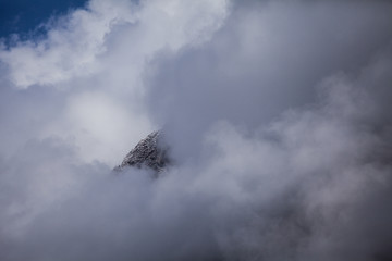 Himalaya cliff peal in fog. View of himalayan peaks in fog from Annapurna Trek - Nepal