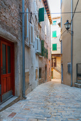 Calm, peaceful little tight narrow streets and colorful houses of Rovinj town