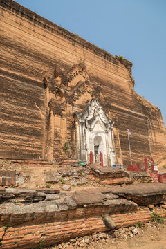 Side view of the ruins of the uncompleted Mingun Pahtodawgyi monument stupa in Mingun near Mandalay in Myanmar on a sunny day.