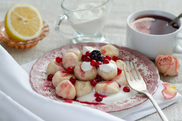 Gnocchi with red currant jam and red currant berries