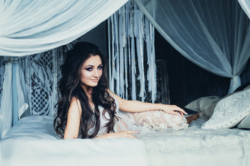 Fototapeta premium Fashion Photo of Young Beautiful Caucasian Brunette in White Retro Background
